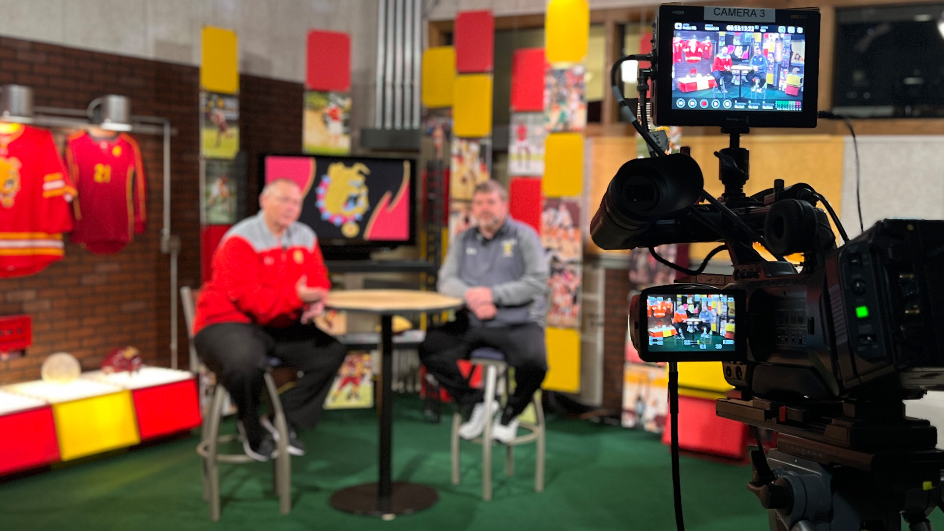host rob bentley and coach greg henson sitting on the set of Ferris Sports Update